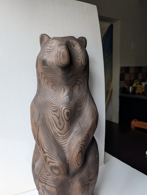 Blackened bear standing